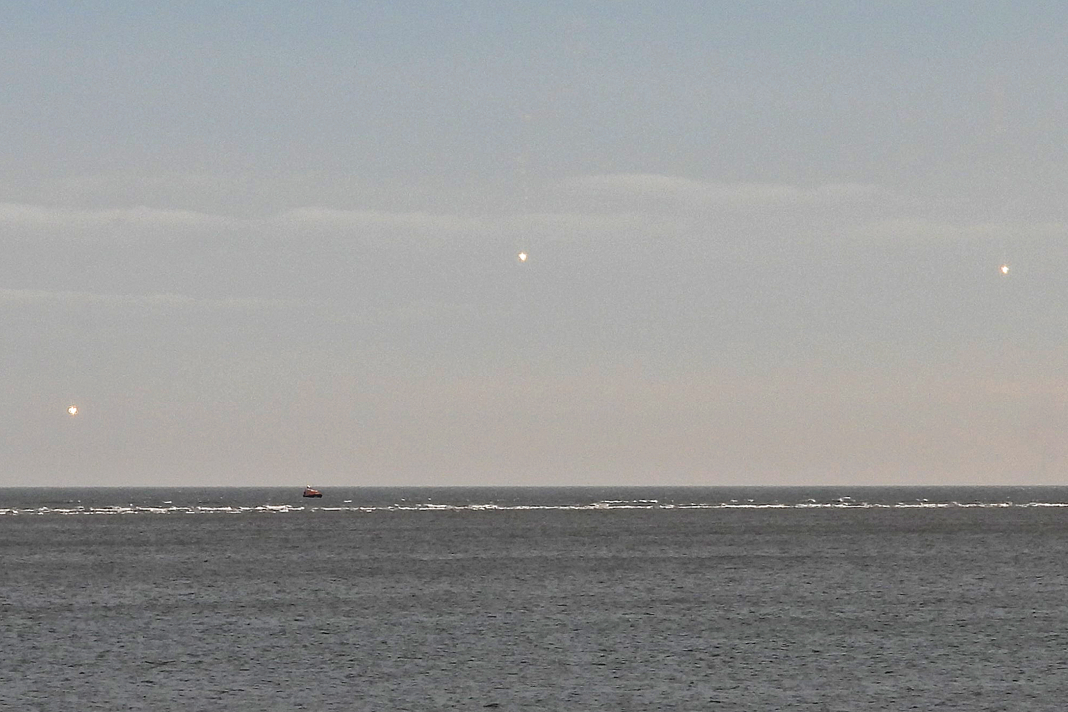 White parachute flares fired off Wells as a goodbye gesture