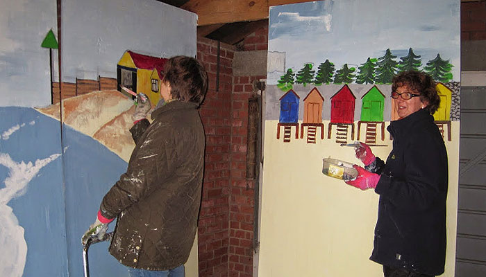 Sue Rainsford on the boathouse and Linda Patrick on beach huts