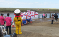 Watching at the finish line as the first finishers run over the marsh and across the channel