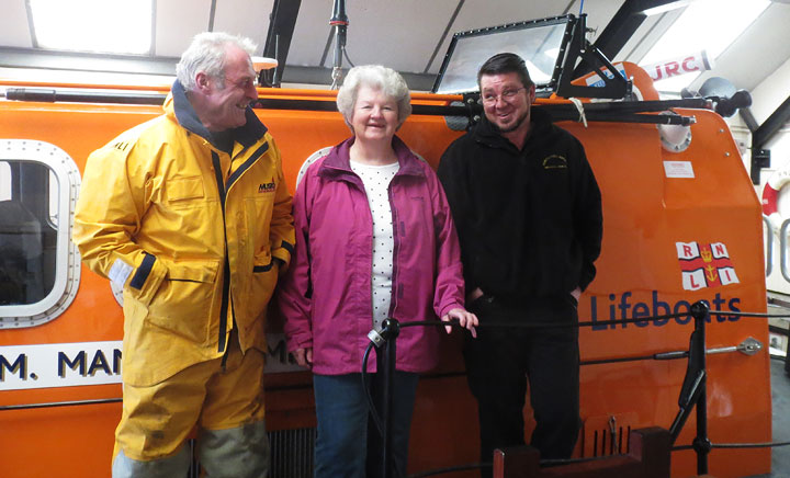 Sky divers Jill and Kieron Scillitoe with Coxswain Allen Frary at the boathouse