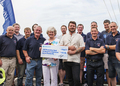 Wells crew with Jill and Kieron Scillitoe receiving a cheque for over 5500