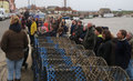 An expectant small crowd gathers on the quay for the mural unveiling 21/3/15