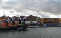 Crew wave to the crowd on the quay after a blustery annual lifeboat service, 10 August 2014