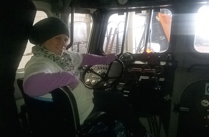 Hazey Coker tries the helm on the Mersey during her fund-raising walk (4/6/16)