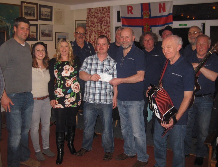 Blakeney Old Wild Rovers present cheque to Wells Deputy Second Coxswain Mark Frary