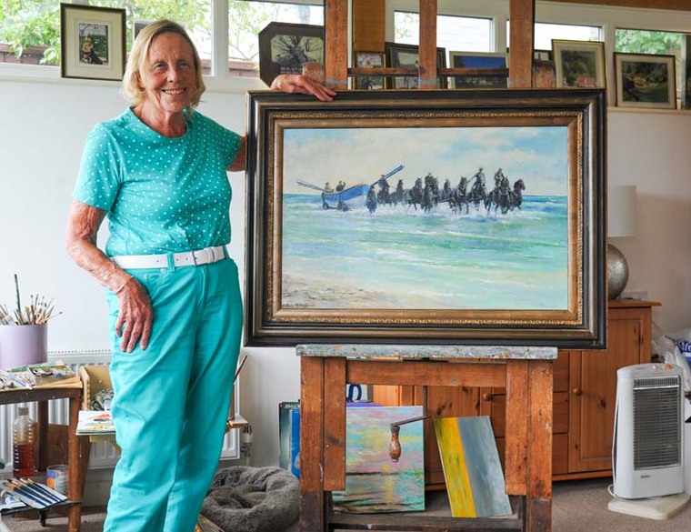 Artist Shirley Carnt with her painting 'Stallions Landing - Wells lifeboat'