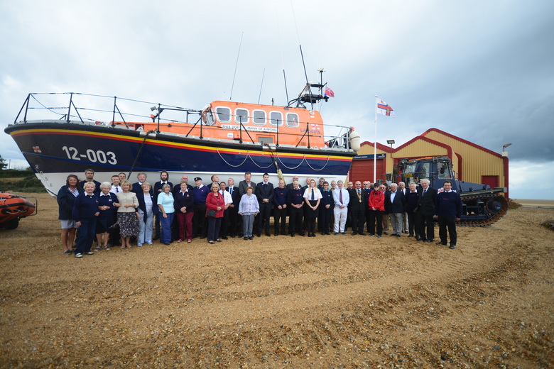 Crew members and guests with the stations current all-weather lifeboat Doris M Mann of Ampthill