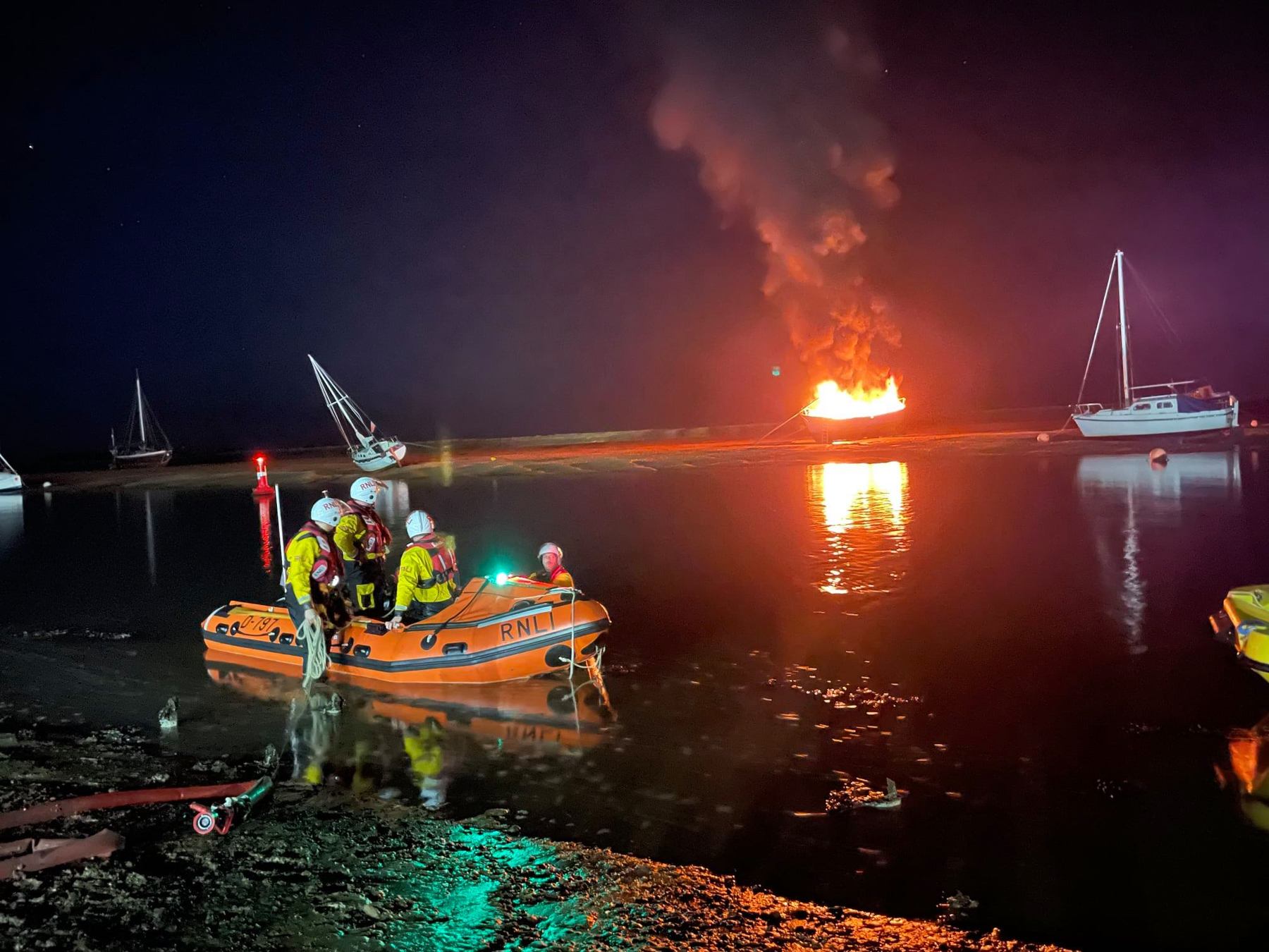 Wells inshore lifeboat attending yacht on fire near Wells quay, 15/10/21