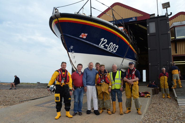 The late Campbell MacCallum (center, blue top) visiting the boathouse in 2018