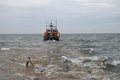 Wells Lifeboat launching off Holkham beach to assist the disabled yacht 'Fantasma'
