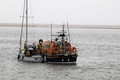 After being towed into Wells, yacht 'Fantasma' is repositioned alongside the lifeboat prior to being safely berthed