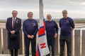 The Earl of Leicester, Peter Rainsford, Richard Cracknell and Martin Emerson prepare to raise the flag at the new station