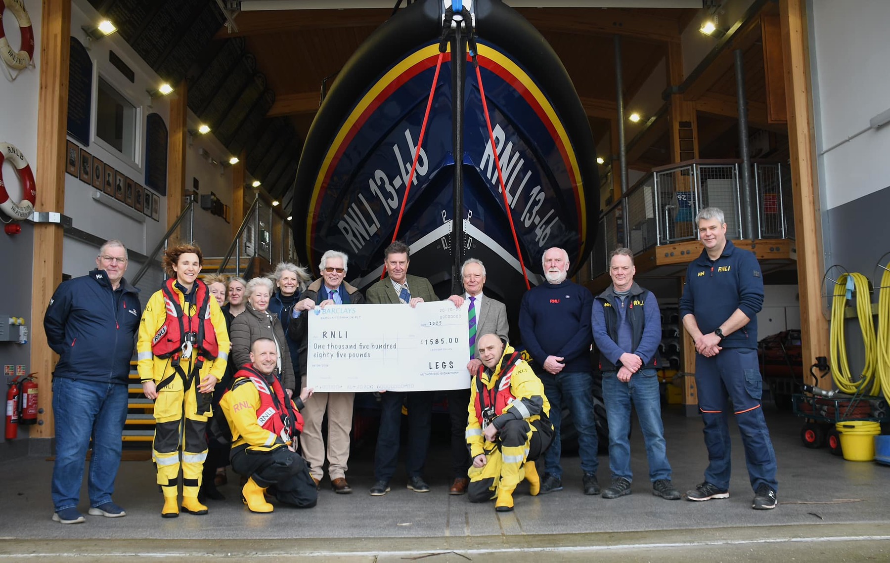 LEGS golfers present a donation to the station