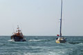 Yacht under tow with departing Skegness Lifeboat alongside, 11/6/2025