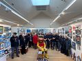 Wells crew and volunteers with Jill Bennett and Stormy Stan with the children's art at the exhibition