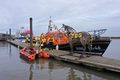 Both lifeboats moored up on the pontoons by the lifeboat horse