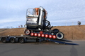 The SLRS tractor, named 'Patricia Jean Bettany' drives carefully off the low loader
