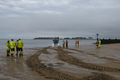 Recovering on the north side for the first time, the SLRS wades into the tide to check the depth and ground before the boat is beached