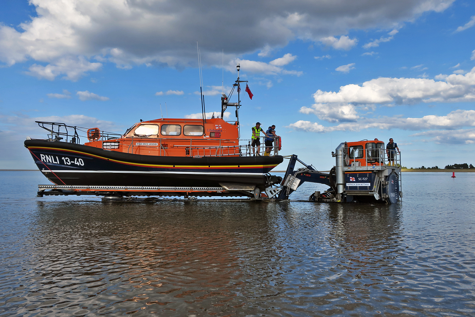 Returning to the boathouse, wading at the edge of the channel on the flood tide