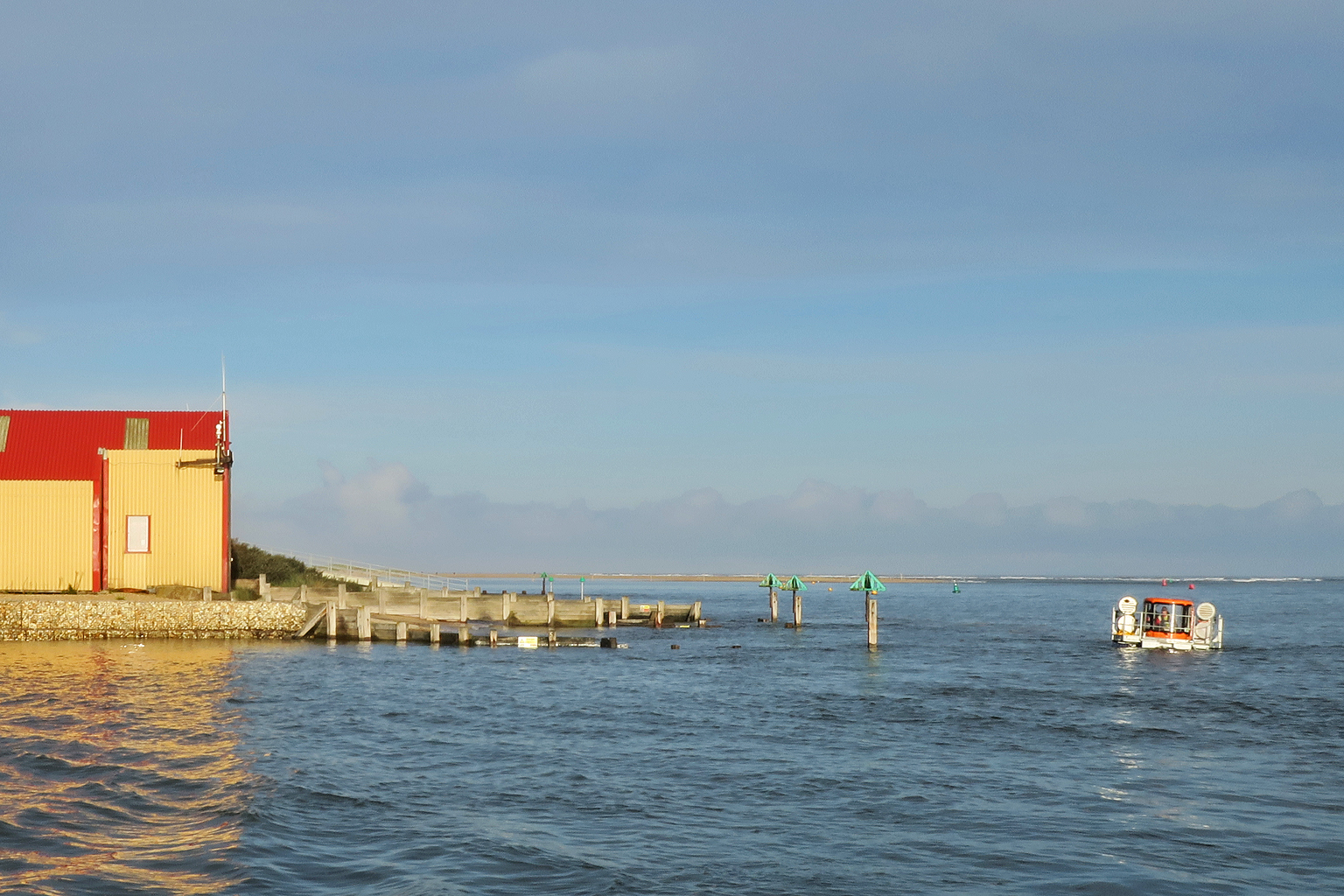 SLRS wading round from the boathouse for a recovery on the south side