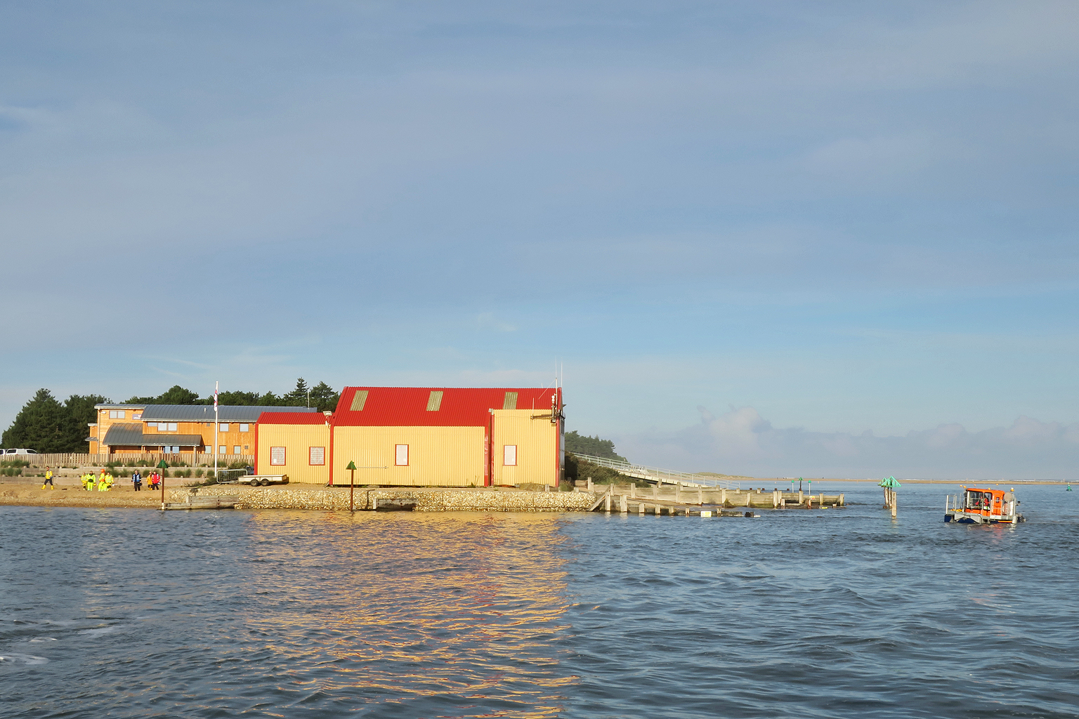 SLRS wading round from the boathouse for a recovery on the south side