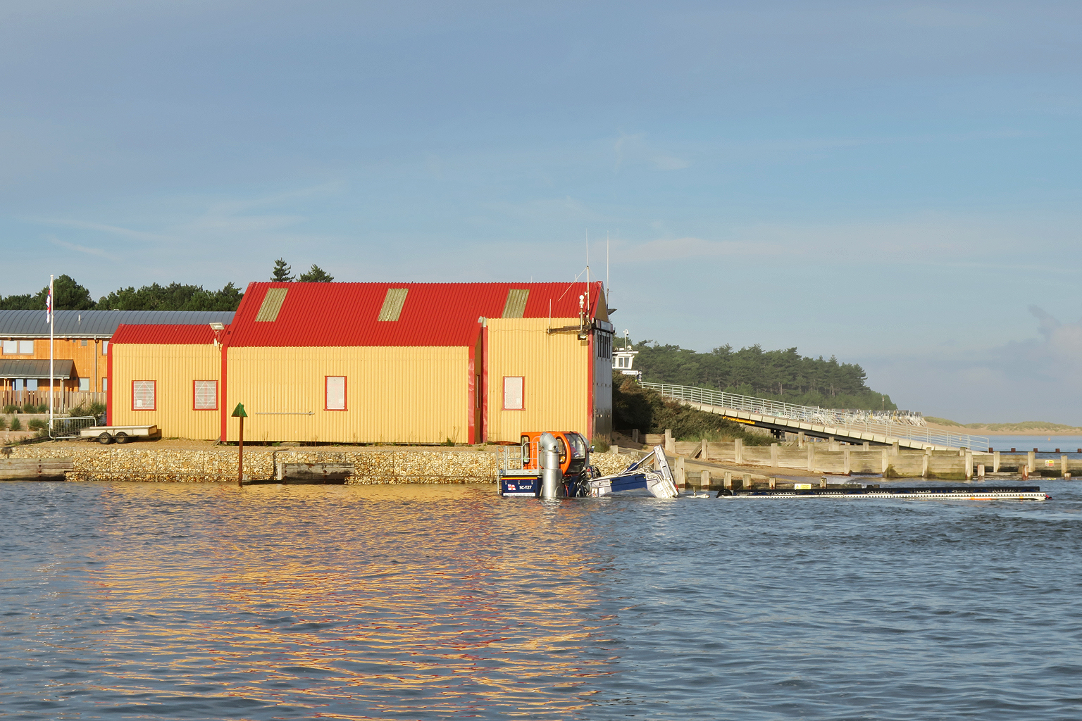 SLRS wading round from the boathouse for a recovery on the south side