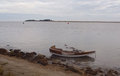 Damaged tender on Beach bank